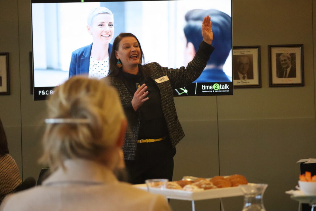 Leadership coach presenting communication skills to women in business